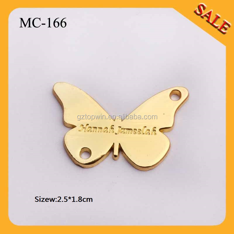 金蝶mc166を模倣するデザインのoemロゴ刻印金色のメッキ金属衣類タグ仕入れ・メーカー・工場