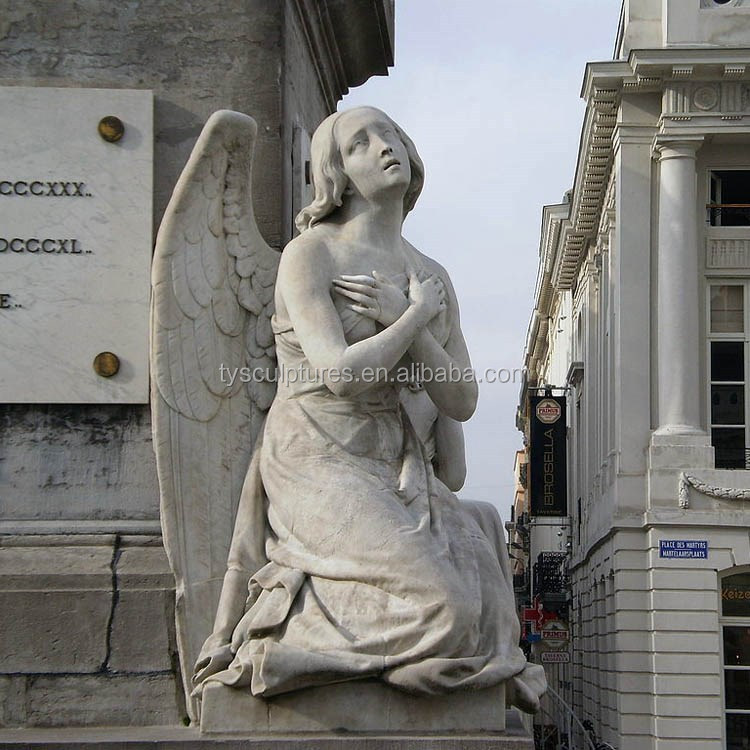 1024px-Angel_sculpture,_Martyrs_Square_-_Place_des_Martyrs_-_Martelaarsplaats_3_(4040194510).jpg