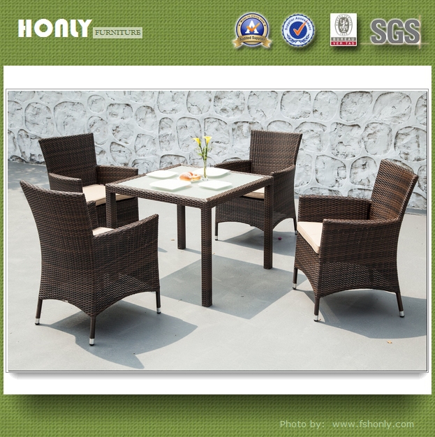 Modern ratan dining table glass top rattan chairs and tables