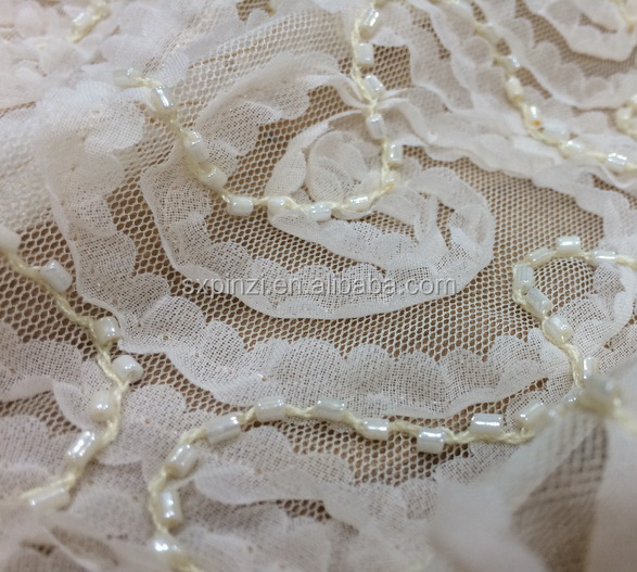 ivory color beaded and chiffon tape coiling embroidery on polyester mesh fabric for children's wear問屋・仕入れ・卸・卸売り