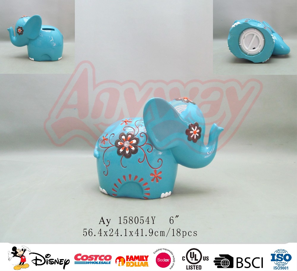 Hand painting blue elephant shape piggy bank
