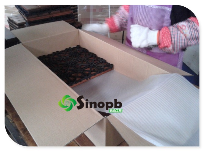 Deck tile with plastic base packing in carton